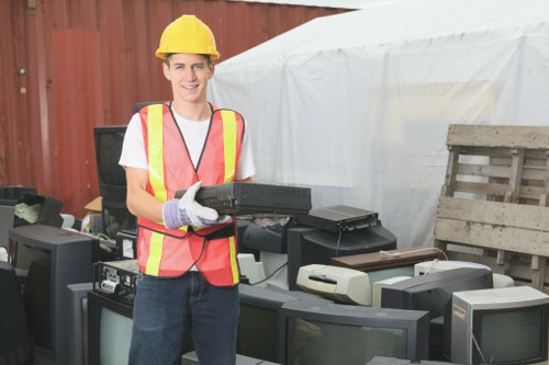 Workers sorting construction debris for recycling in Hoddesdon